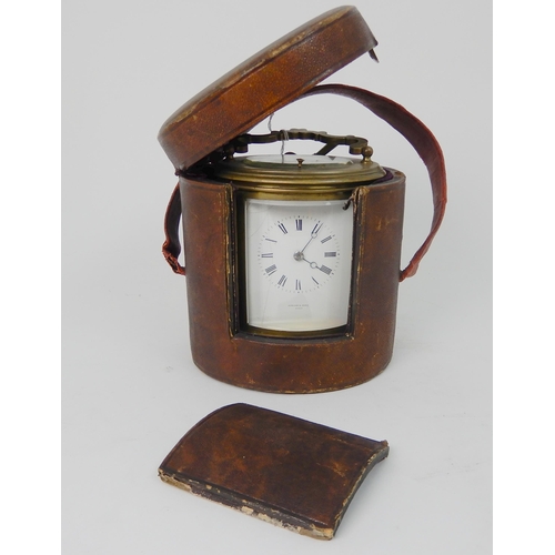 572 - A 19TH CENTURY LARGE OVAL BRASS REPEATING CARRIAGE CLOCK