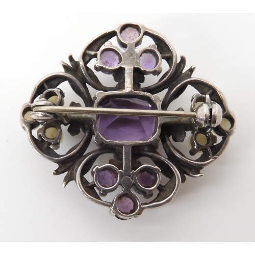 628 - AN AMETHYST AND PEARL BROOCH IN THE STYLE OF BERNARD INSTONE