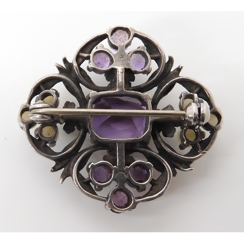 628 - AN AMETHYST AND PEARL BROOCH IN THE STYLE OF BERNARD INSTONE