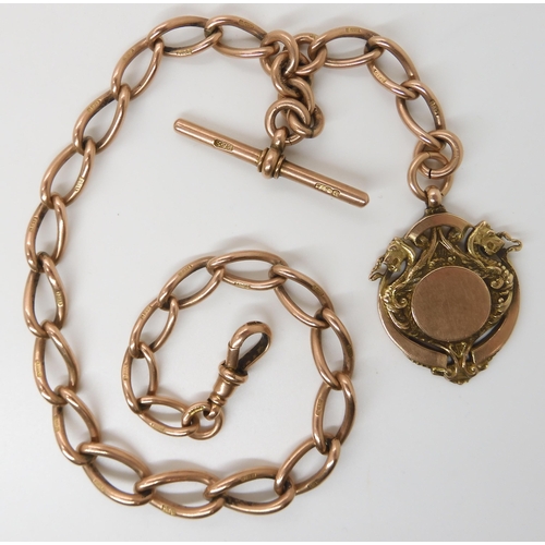 630 - A 9CT ROSE GOLD TAPERED FOB CHAIN WITH DRAGON MEDALLION