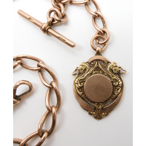 630 - A 9CT ROSE GOLD TAPERED FOB CHAIN WITH DRAGON MEDALLION