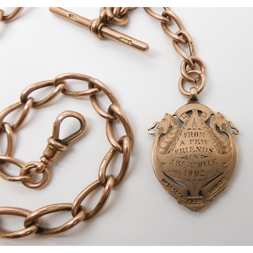 630 - A 9CT ROSE GOLD TAPERED FOB CHAIN WITH DRAGON MEDALLION