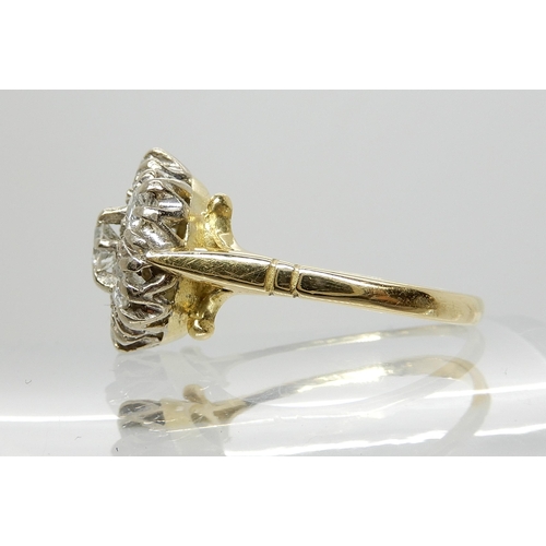 641 - AN 18CT GOLD DIAMOND FLOWER RING