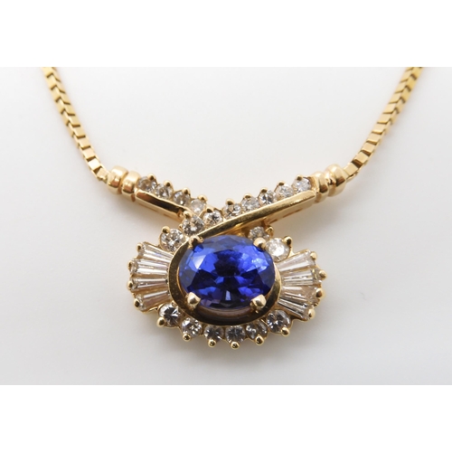 642 - A 14K GOLD TANZANITE AND DIAMOND NECKLET