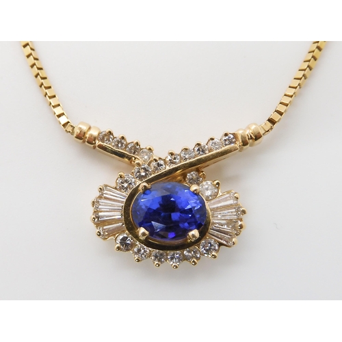 642 - A 14K GOLD TANZANITE AND DIAMOND NECKLET