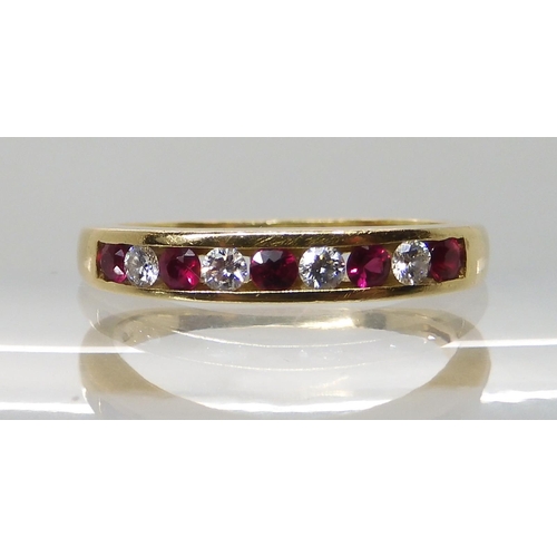 648 - AN 18CT RUBY AND DIAMOND HALF ETERNITY RING