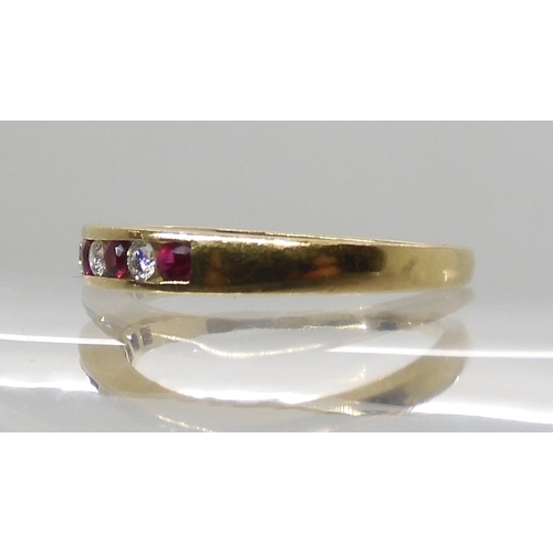 648 - AN 18CT RUBY AND DIAMOND HALF ETERNITY RING