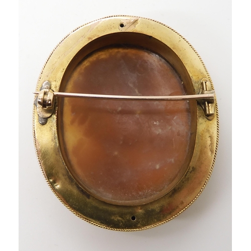 651 - A YELLOW METAL MOUNTED SHELL CAMEO BROOCH OF A MAIDEN