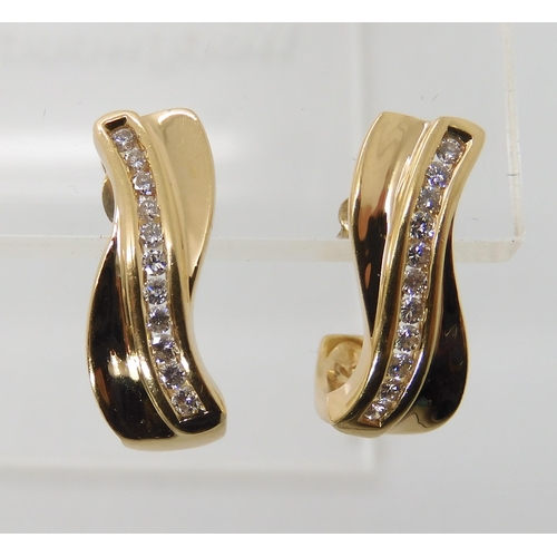 652 - A PAIR OF 18CT GOLD AND DIAMOND EARRINGS