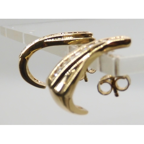 652 - A PAIR OF 18CT GOLD AND DIAMOND EARRINGS