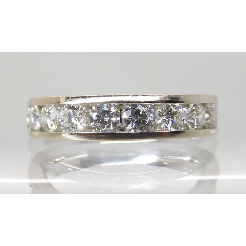 661 - AN 18CT WHITE GOLD DIAMOND HALF ETERNITY RING