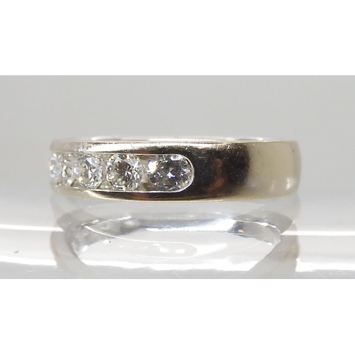 661 - AN 18CT WHITE GOLD DIAMOND HALF ETERNITY RING