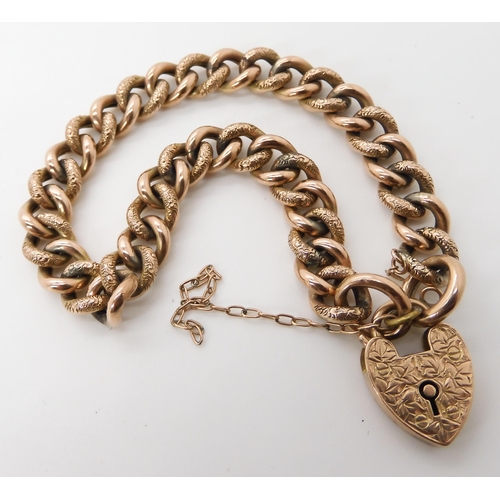 662 - A 9CT GOLD CURB CHAIN BRACELET WITH HEART SHAPED CLASP