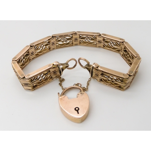 665 - A 9CT GOLD DECORATIVE GATE BRACELET