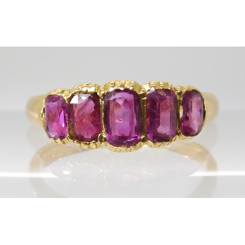 668 - A BRIGHT YELLOW FIVE STONE RUBY RING