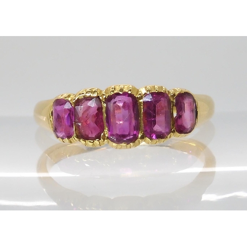 668 - A BRIGHT YELLOW FIVE STONE RUBY RING