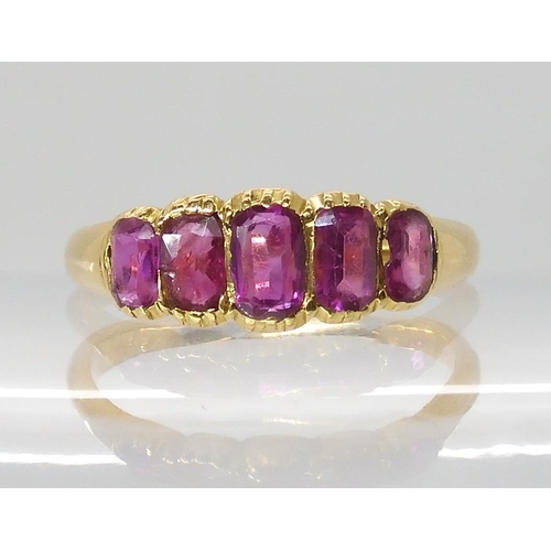 668 - A BRIGHT YELLOW FIVE STONE RUBY RING