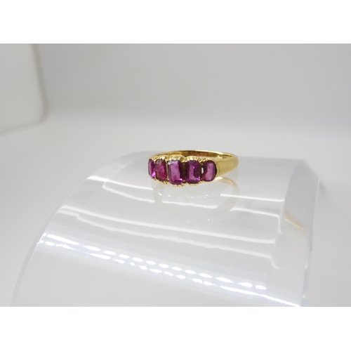 668 - A BRIGHT YELLOW FIVE STONE RUBY RING