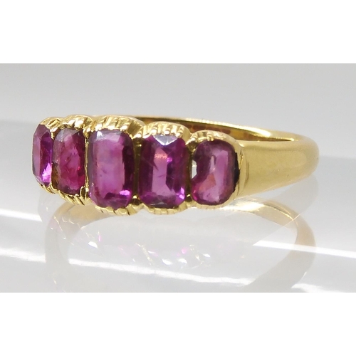 668 - A BRIGHT YELLOW FIVE STONE RUBY RING