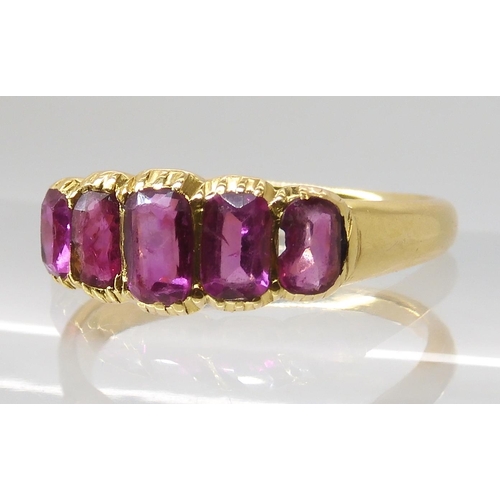 668 - A BRIGHT YELLOW FIVE STONE RUBY RING