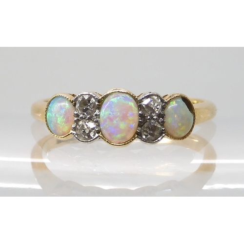 669 - AN 18CT OPAL AND DIAMOND RING