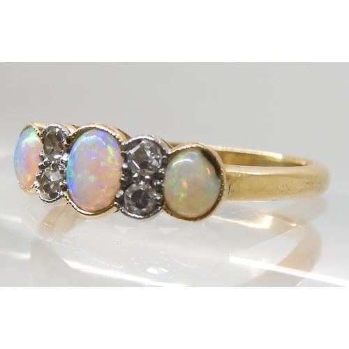 669 - AN 18CT OPAL AND DIAMOND RING