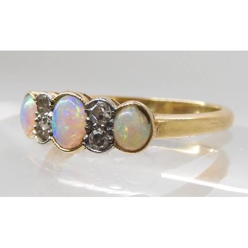 669 - AN 18CT OPAL AND DIAMOND RING