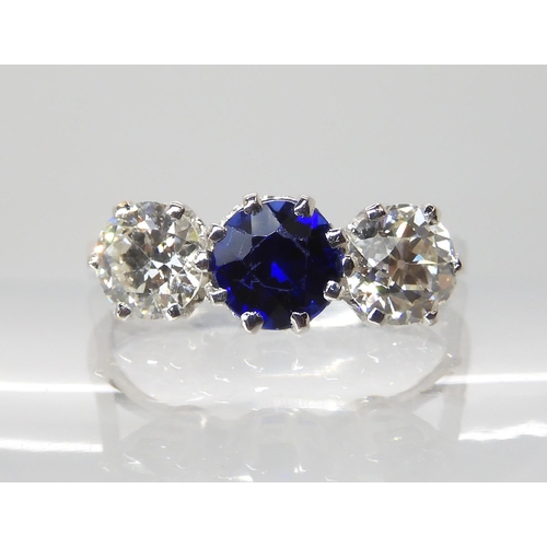 671 - AN 18CT WHITE GOLD FAUX SAPPHIRE AND DIAMOND RING