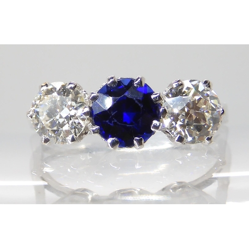 671 - AN 18CT WHITE GOLD FAUX SAPPHIRE AND DIAMOND RING