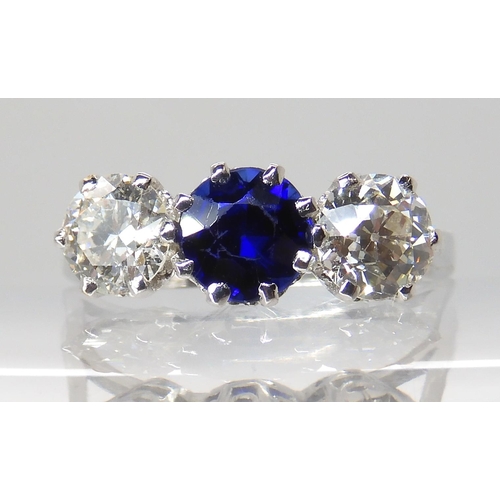 671 - AN 18CT WHITE GOLD FAUX SAPPHIRE AND DIAMOND RING