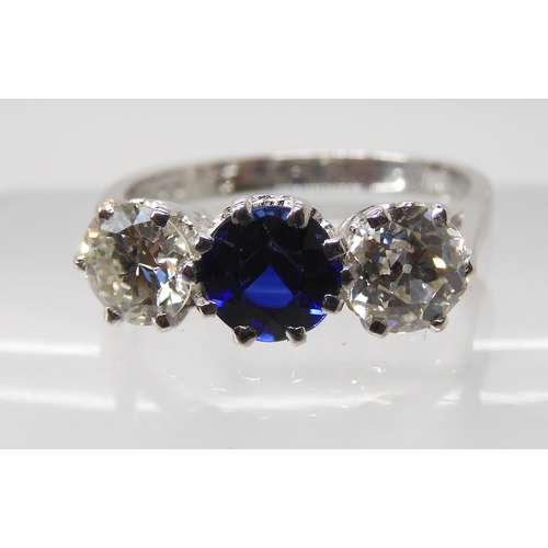 671 - AN 18CT WHITE GOLD FAUX SAPPHIRE AND DIAMOND RING