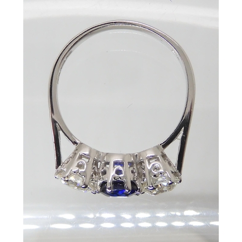 671 - AN 18CT WHITE GOLD FAUX SAPPHIRE AND DIAMOND RING