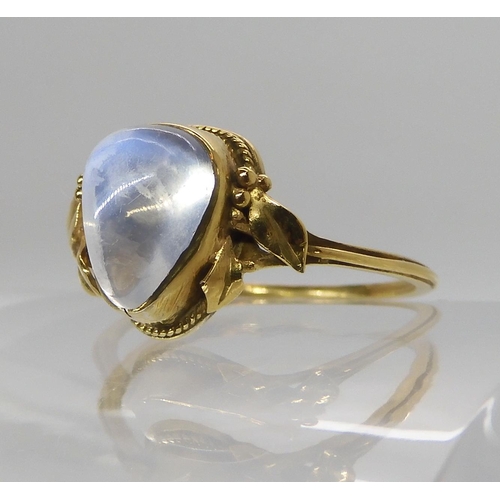 674 - AN ARTS & CRAFTS YELLOW METAL AND MOONSTONE RING AND EARRINGS