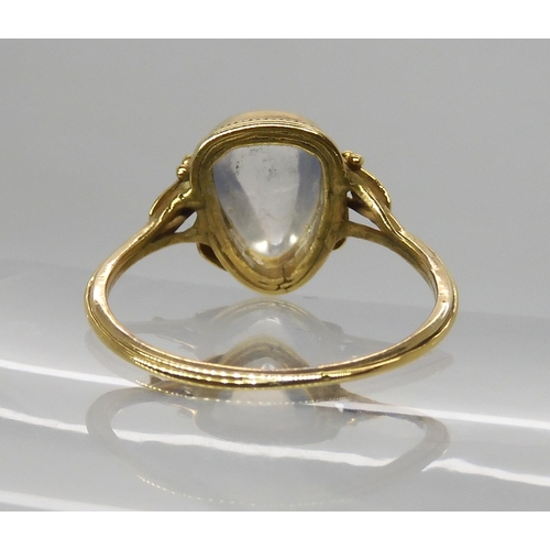 674 - AN ARTS & CRAFTS YELLOW METAL AND MOONSTONE RING AND EARRINGS