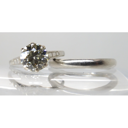 680 - A PLATINUM DIAMOND SOLITAIRE RING WITH MATCHING WEDDING BAND