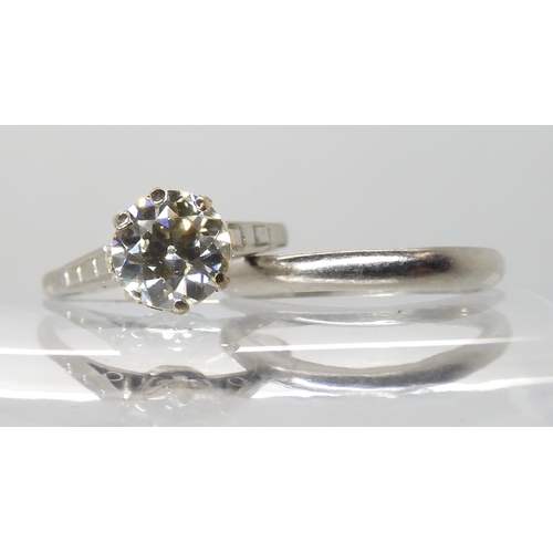 680 - A PLATINUM DIAMOND SOLITAIRE RING WITH MATCHING WEDDING BAND