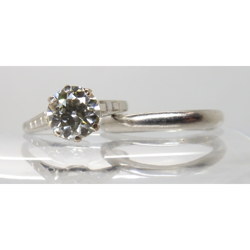 680 - A PLATINUM DIAMOND SOLITAIRE RING WITH MATCHING WEDDING BAND