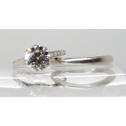 680 - A PLATINUM DIAMOND SOLITAIRE RING WITH MATCHING WEDDING BAND