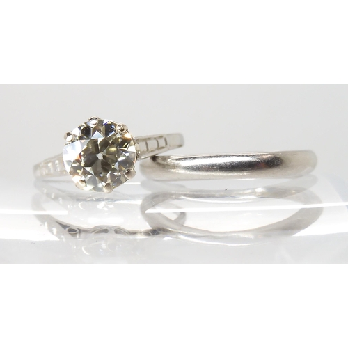 680 - A PLATINUM DIAMOND SOLITAIRE RING WITH MATCHING WEDDING BAND