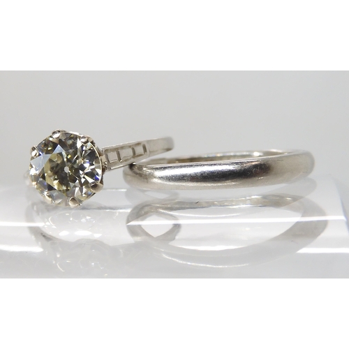 680 - A PLATINUM DIAMOND SOLITAIRE RING WITH MATCHING WEDDING BAND