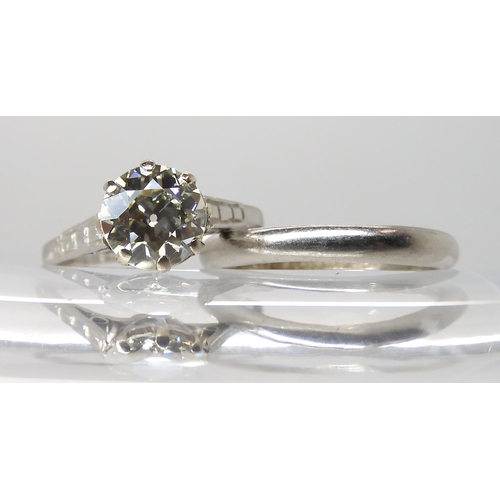 680 - A PLATINUM DIAMOND SOLITAIRE RING WITH MATCHING WEDDING BAND