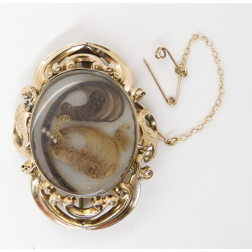 682 - A HAIR LOCKET BACK MOURNING BROOCH