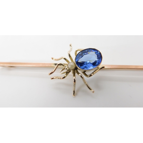 684 - A 9CT GOLD GEM SET SPIDER BROOCH