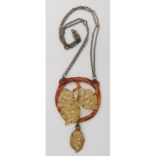 686 - A CARVED HORN ART NOUVEAU PENDANT