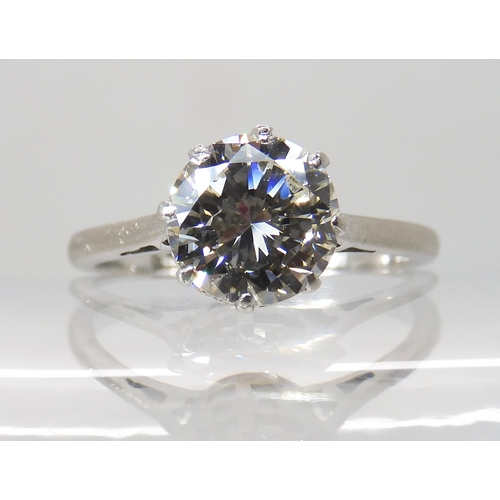 694 - AN 18CT WHITE GOLD AND PLATINUM SOLITAIRE DIAMOND RING