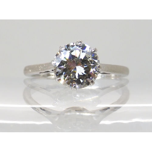 694 - AN 18CT WHITE GOLD AND PLATINUM SOLITAIRE DIAMOND RING