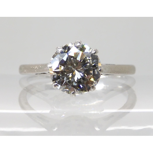 694 - AN 18CT WHITE GOLD AND PLATINUM SOLITAIRE DIAMOND RING