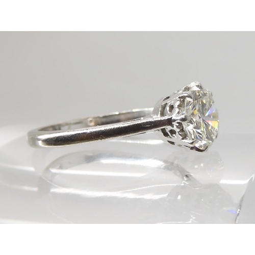 694 - AN 18CT WHITE GOLD AND PLATINUM SOLITAIRE DIAMOND RING