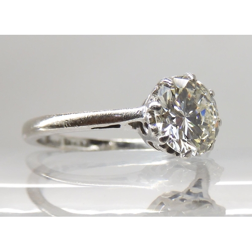 694 - AN 18CT WHITE GOLD AND PLATINUM SOLITAIRE DIAMOND RING