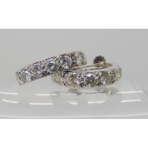 695C - A PAIR OF 9CT WHITE GOLD DIAMOND HOOP EARRINGS